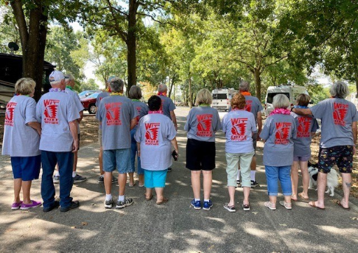 Group of people showing their Missouri Chief Winnies shirts.